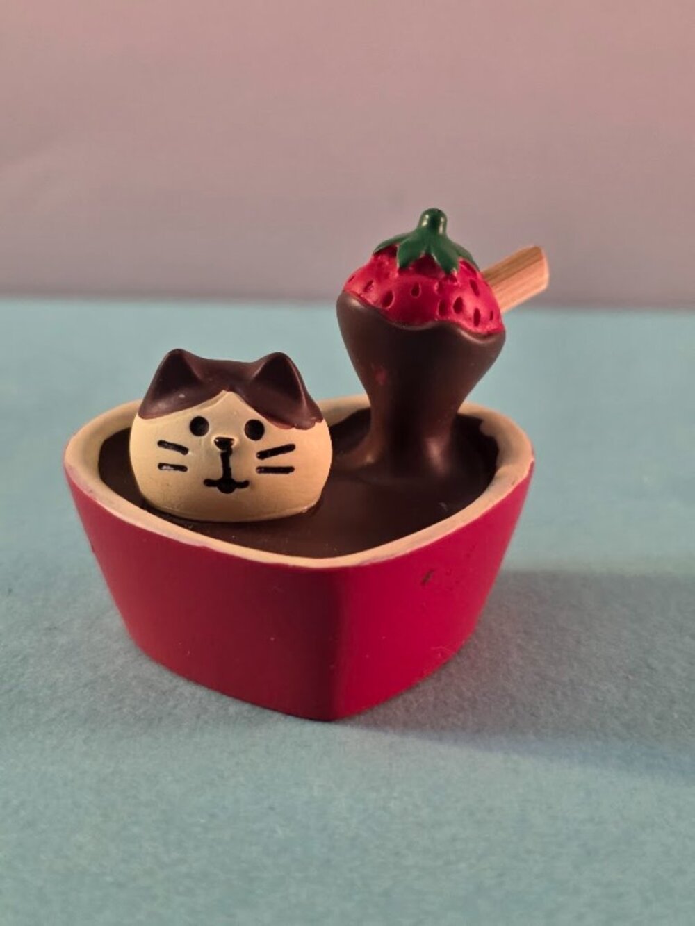 Small resin cat in a chocolate heart